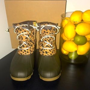 Sperry Saltwater animal print rubber boot.